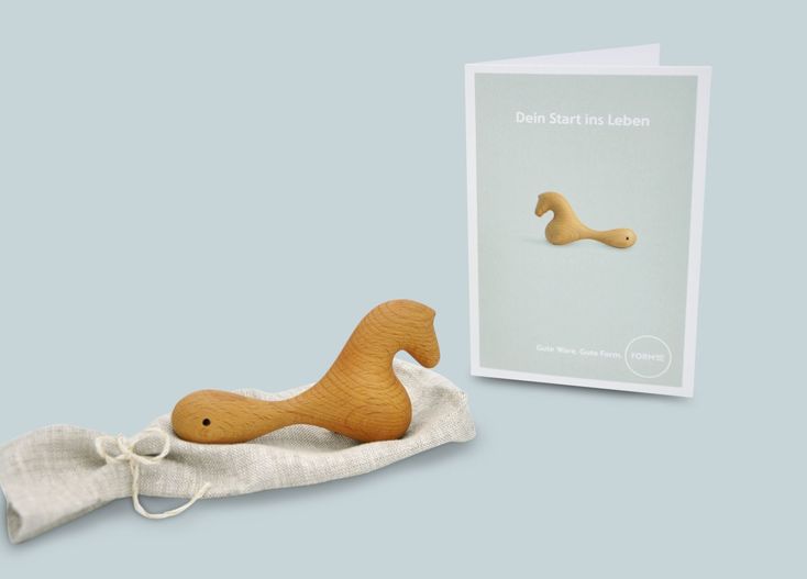  Set contains: Zartoy baby rattle in a linen sack Gift wrapping Greeting card 